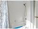 A standard shower/tub combo with tiled walls and a shower curtain at 4875 Wood Pointe Way, Sarasota, FL 34233
