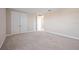 Empty bedroom with carpet and double doors at 4877 Antrim Dr, Sarasota, FL 34240