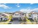 Two-story house with a two-car garage, stone accents and a tile roof at 4877 Antrim Dr, Sarasota, FL 34240