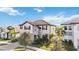 Two-story house with a two-car garage, stone accents and a tile roof at 4877 Antrim Dr, Sarasota, FL 34240