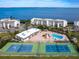 Community features tennis courts, pool, and waterfront access at 4900 Gulf Of Mexico Dr # 205, Longboat Key, FL 34228