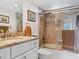 Clean bathroom with granite countertop and bathtub at 4900 Gulf Of Mexico Dr # 205, Longboat Key, FL 34228