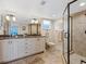 Bathroom with granite vanity and a walk-in shower at 4900 Gulf Of Mexico Dr # 205, Longboat Key, FL 34228