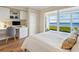 Bedroom with built-in workspace and water views at 4900 Gulf Of Mexico Dr # 205, Longboat Key, FL 34228