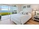 Bright bedroom with water views and a comfortable bed at 4900 Gulf Of Mexico Dr # 205, Longboat Key, FL 34228