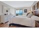 Spacious bedroom with water views and a dresser at 4900 Gulf Of Mexico Dr # 205, Longboat Key, FL 34228