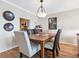 Bright dining area with hardwood floors and a view of the kitchen at 4900 Gulf Of Mexico Dr # 205, Longboat Key, FL 34228