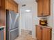 Modern kitchen features stainless steel appliances and light wood cabinets at 4900 Gulf Of Mexico Dr # 205, Longboat Key, FL 34228
