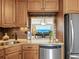 Kitchen with a breakfast bar and a view of the dining area and water at 4900 Gulf Of Mexico Dr # 205, Longboat Key, FL 34228