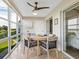Bright lanai with table and chairs, offering scenic views at 4900 Gulf Of Mexico Dr # 205, Longboat Key, FL 34228