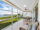 Spacious lanai with water views and seating area at 4900 Gulf Of Mexico Dr # 205, Longboat Key, FL 34228