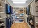 Large walk-in closet with ample shelving and hanging space at 4900 Gulf Of Mexico Dr # 205, Longboat Key, FL 34228