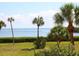 Scenic waterfront view with lush landscaping at 4900 Gulf Of Mexico Dr # 205, Longboat Key, FL 34228