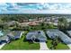 Aerial view of a residential neighborhood featuring well-maintained homes and mature trees at 5024 Southern Pine Cir, Venice, FL 34293