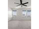 Spacious bedroom with ceiling fan and window at 5316 Rocky Coast Place, Palmetto, FL 34221