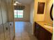 Bathroom with granite vanity and mirrored closet at 5405 Fair Oaks St # 5405, Bradenton, FL 34203