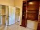 Bedroom with closet and dark wood shelving and desk unit, plus washer and dryer at 5405 Fair Oaks St # 5405, Bradenton, FL 34203