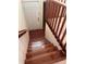 Home entryway featuring hardwood staircase, tile landing, and white front door at 5405 Fair Oaks St # 5405, Bradenton, FL 34203