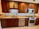 Beautiful kitchen with stainless steel appliances, stylish backsplash, granite countertops, and ample cabinet space at 5405 Fair Oaks St # 5405, Bradenton, FL 34203