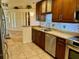 This kitchen features a stone countertop, tile backsplash, and stainless steel appliances at 5405 Fair Oaks St # 5405, Bradenton, FL 34203