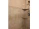 The shower has a hand shower and corner shelves with decorative tile at 5405 Fair Oaks St # 5405, Bradenton, FL 34203