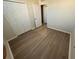 Bedroom with wood-look flooring, closet, and neutral walls at 5467 Soapstone Pl # 203, Sarasota, FL 34233