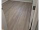 Empty room with wood-look flooring at 5467 Soapstone Pl # 203, Sarasota, FL 34233