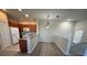 Kitchen and dining area with wood-look floors and granite countertops at 5467 Soapstone Pl # 203, Sarasota, FL 34233