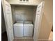 Laundry room with a stacked washer and dryer at 5467 Soapstone Pl # 203, Sarasota, FL 34233