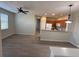 Open living area with wood-look flooring and view of kitchen at 5467 Soapstone Pl # 203, Sarasota, FL 34233