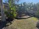 Community playground with slides, climbing structures, and lush landscaping at 5467 Soapstone Pl # 203, Sarasota, FL 34233