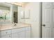 Bright bathroom with vanity and mirrored medicine cabinet at 566 Oak Bay Dr, Osprey, FL 34229