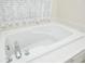 Clean bathroom with a large, modern bathtub at 566 Oak Bay Dr, Osprey, FL 34229