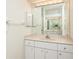 Bathroom featuring a vanity with large mirror and white cabinets at 566 Oak Bay Dr, Osprey, FL 34229
