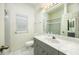 Bathroom with gray vanity and tiled shower/tub at 566 Oak Bay Dr, Osprey, FL 34229