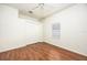 Bedroom with hardwood floors and double door closet at 566 Oak Bay Dr, Osprey, FL 34229