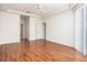 Primary bedroom with hardwood floors and access to other rooms at 566 Oak Bay Dr, Osprey, FL 34229