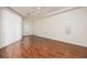 Spacious bedroom with hardwood floors and multiple windows at 566 Oak Bay Dr, Osprey, FL 34229