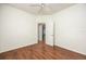 Bedroom with hardwood floors and access to another room at 566 Oak Bay Dr, Osprey, FL 34229