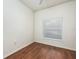 Bright bedroom with hardwood floors and window blinds at 566 Oak Bay Dr, Osprey, FL 34229