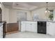 Kitchen boasts an island, white cabinets, and gray countertops at 566 Oak Bay Dr, Osprey, FL 34229