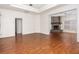 Living room with hardwood floors and a stone fireplace at 566 Oak Bay Dr, Osprey, FL 34229