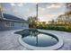 Inviting kidney-shaped pool and patio area at 566 Oak Bay Dr, Osprey, FL 34229