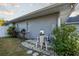 Rear exterior view of home showcasing pool filter and pump system at 566 Oak Bay Dr, Osprey, FL 34229