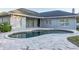 Charming kidney-shaped pool with patio and home view at 566 Oak Bay Dr, Osprey, FL 34229