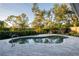 Relaxing kidney-shaped pool with a patio area at 566 Oak Bay Dr, Osprey, FL 34229