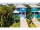 Aerial view of a charming blue house and neighborhood, near the beach at 7007 Holmes Blvd, Holmes Beach, FL 34217