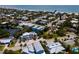 Coastal neighborhood aerial view, highlighting a blue house near the water at 7007 Holmes Blvd, Holmes Beach, FL 34217