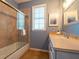 Clean bathroom with a tub shower combo and single vanity at 7007 Holmes Blvd, Holmes Beach, FL 34217