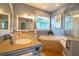 Bathroom boasting a corner soaking tub and double vanity at 7007 Holmes Blvd, Holmes Beach, FL 34217